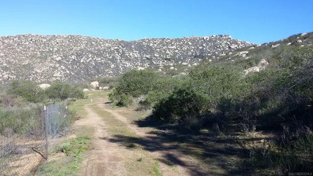 a view of a building with mountains in the background