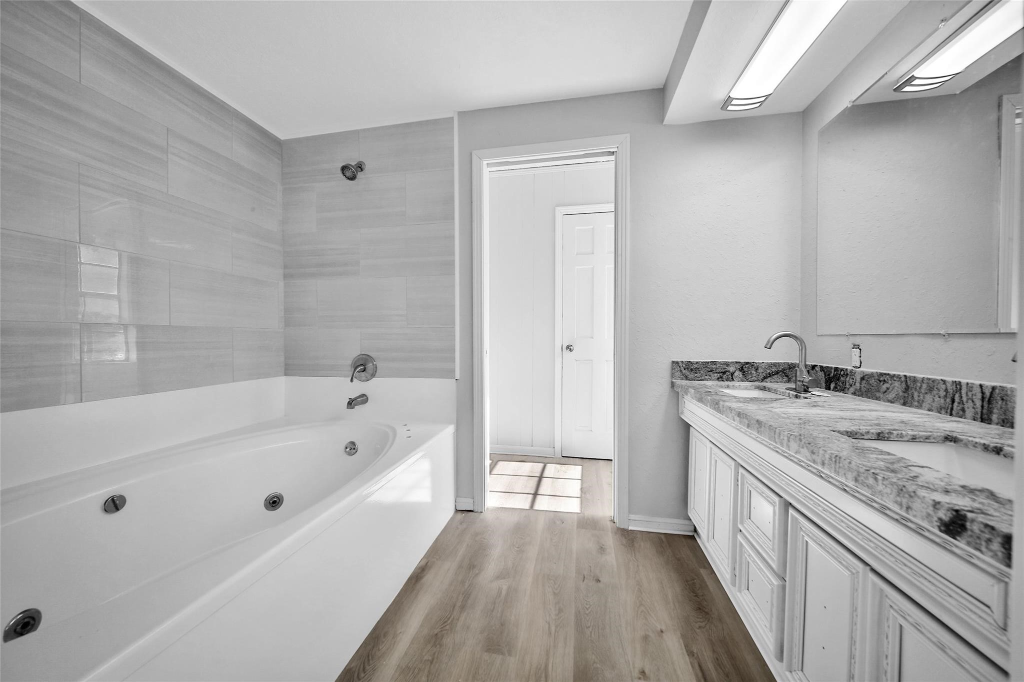 13426 Balcrest Drive Houston, TX 77070 - Photo 12 of 22 a spacious bathroom with a tub sink and mirror