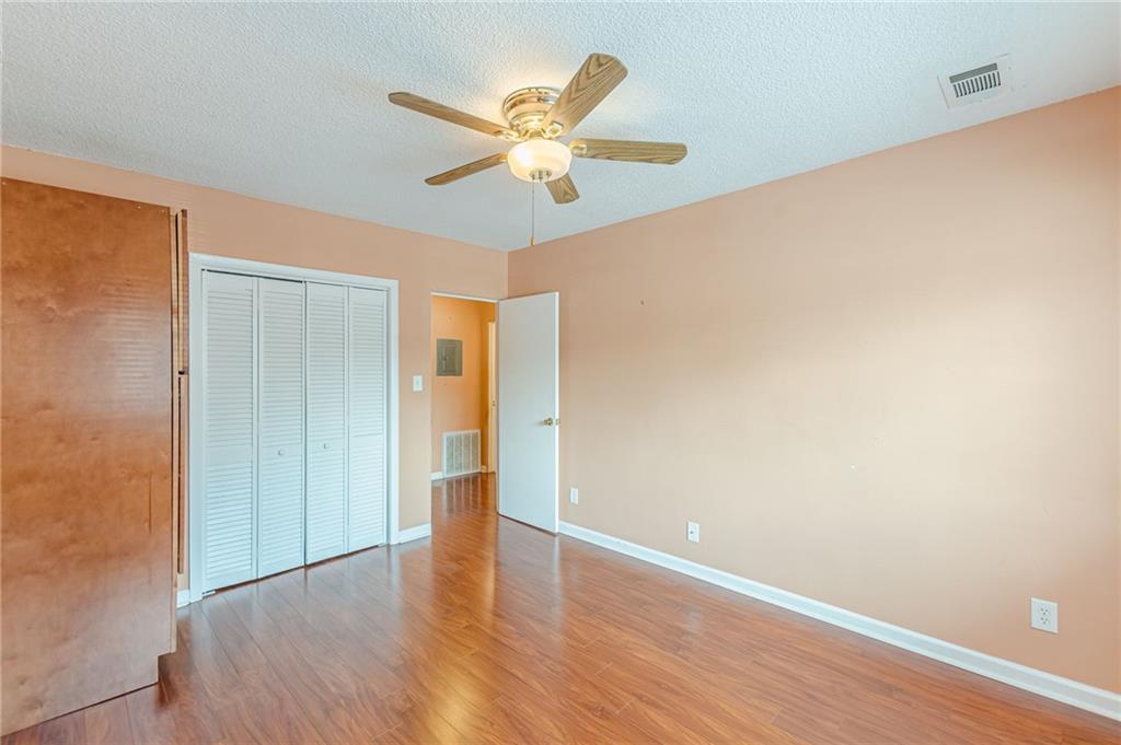 1705 Monroe Drive Northeast, Unit C05 Atlanta, GA 30324 - Photo 13 of 29 a view of an empty room with wooden floor