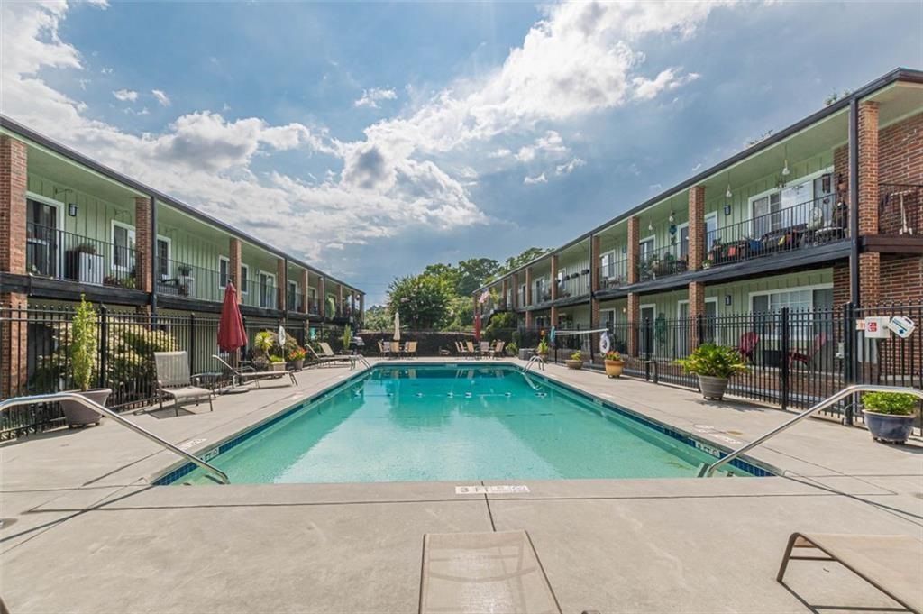 1705 Monroe Drive Northeast, Unit C05 Atlanta, GA 30324 - Photo 26 of 29 a view of a swimming pool with sitting area