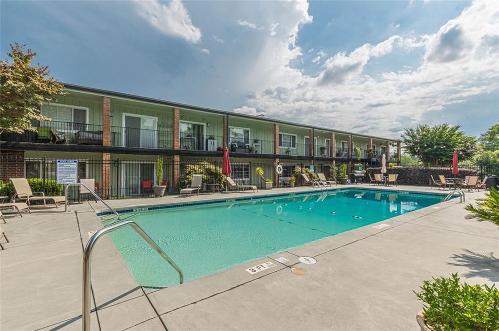 1705 Monroe Drive Northeast, Unit C05 Atlanta, GA 30324 - Photo 27 of 29 an outdoor view of house with swimming pool and furniture