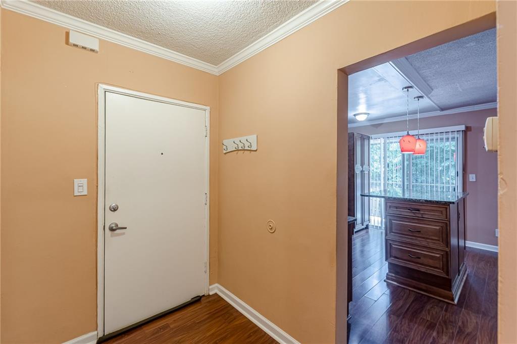 1705 Monroe Drive Northeast, Unit C05 Atlanta, GA 30324 - Photo 6 of 29 a view of front door with wooden floor