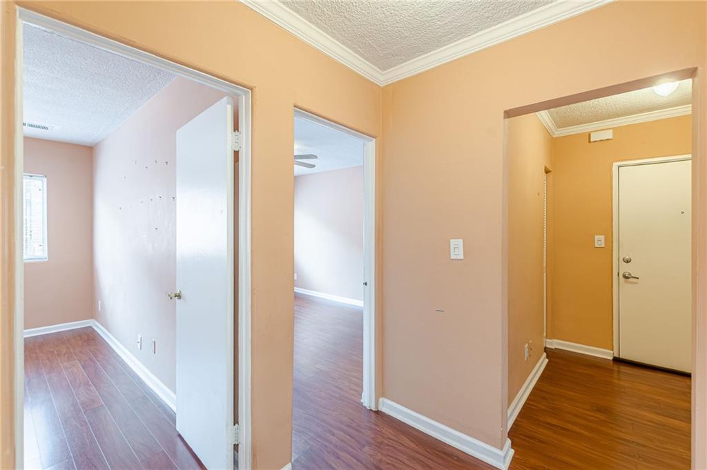 1705 Monroe Drive Northeast, Unit C05 Atlanta, GA 30324 - Photo 7 of 29 a view of a hallway with wooden floor