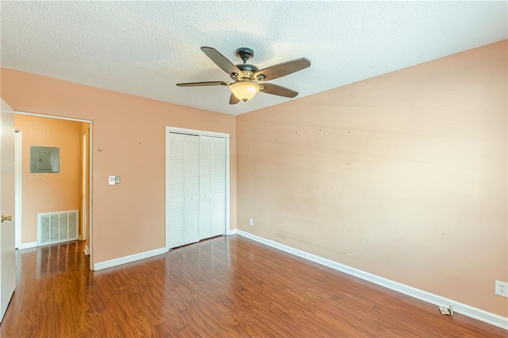 1705 Monroe Drive Northeast, Unit C05 Atlanta, GA 30324 - Photo 9 of 29 a view of an empty room with wooden floor