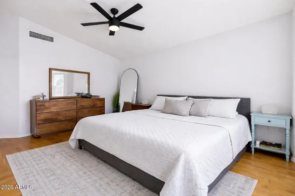 a bedroom with bed and window
