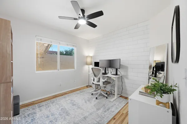 a work room with furniture and potted plants