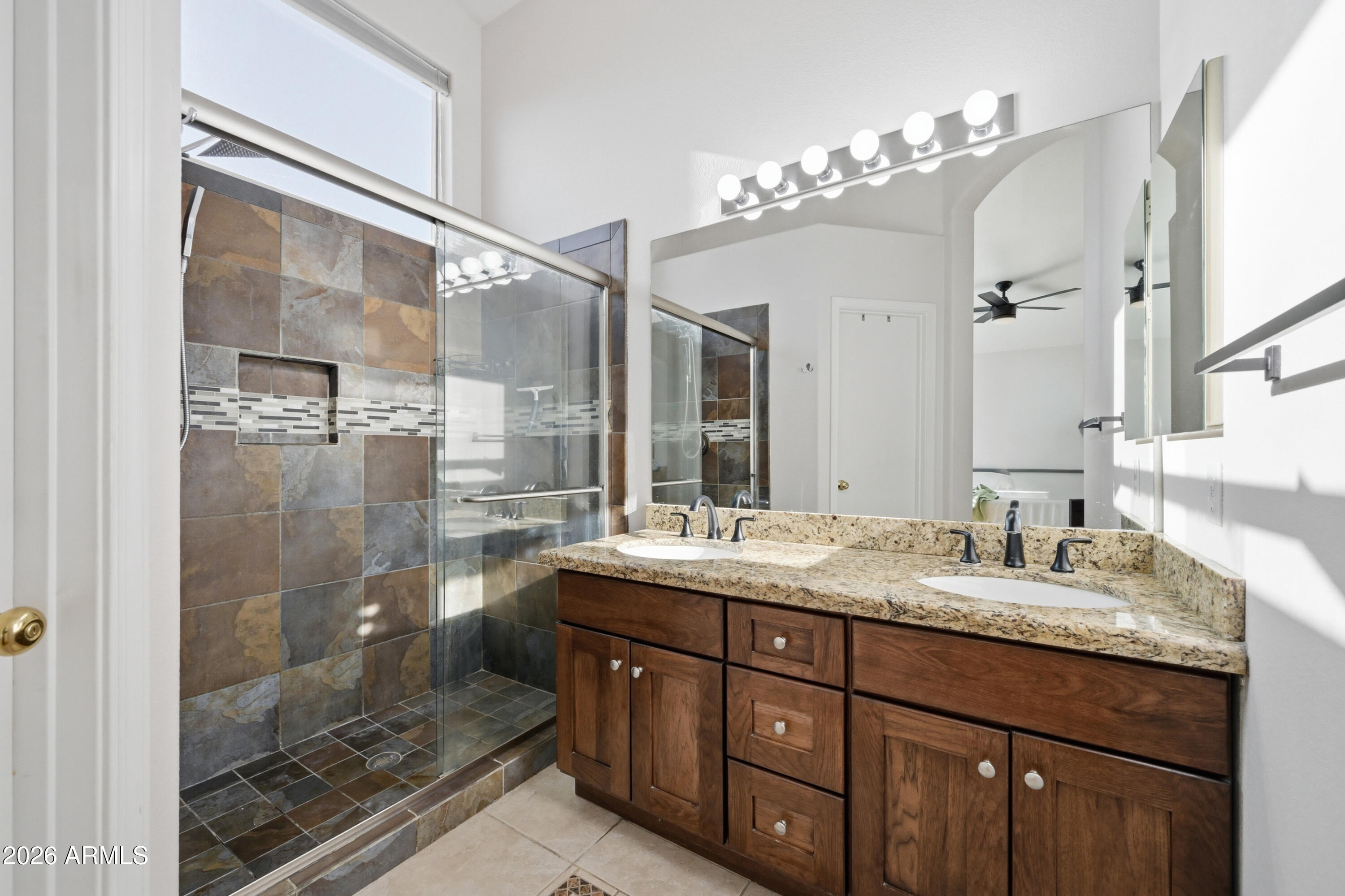 1994 South Spartan Street Gilbert, AZ 85233 - Photo 3 of 30 a bathroom with a granite countertop sink mirror and shower