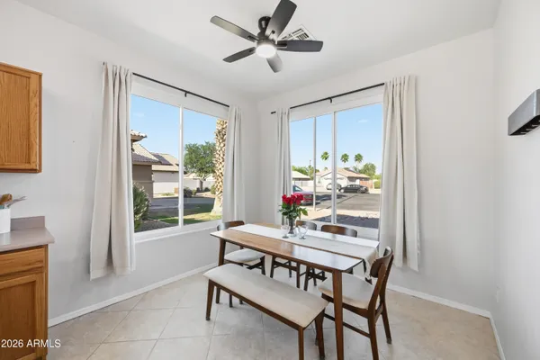 a dining room with furniture and window