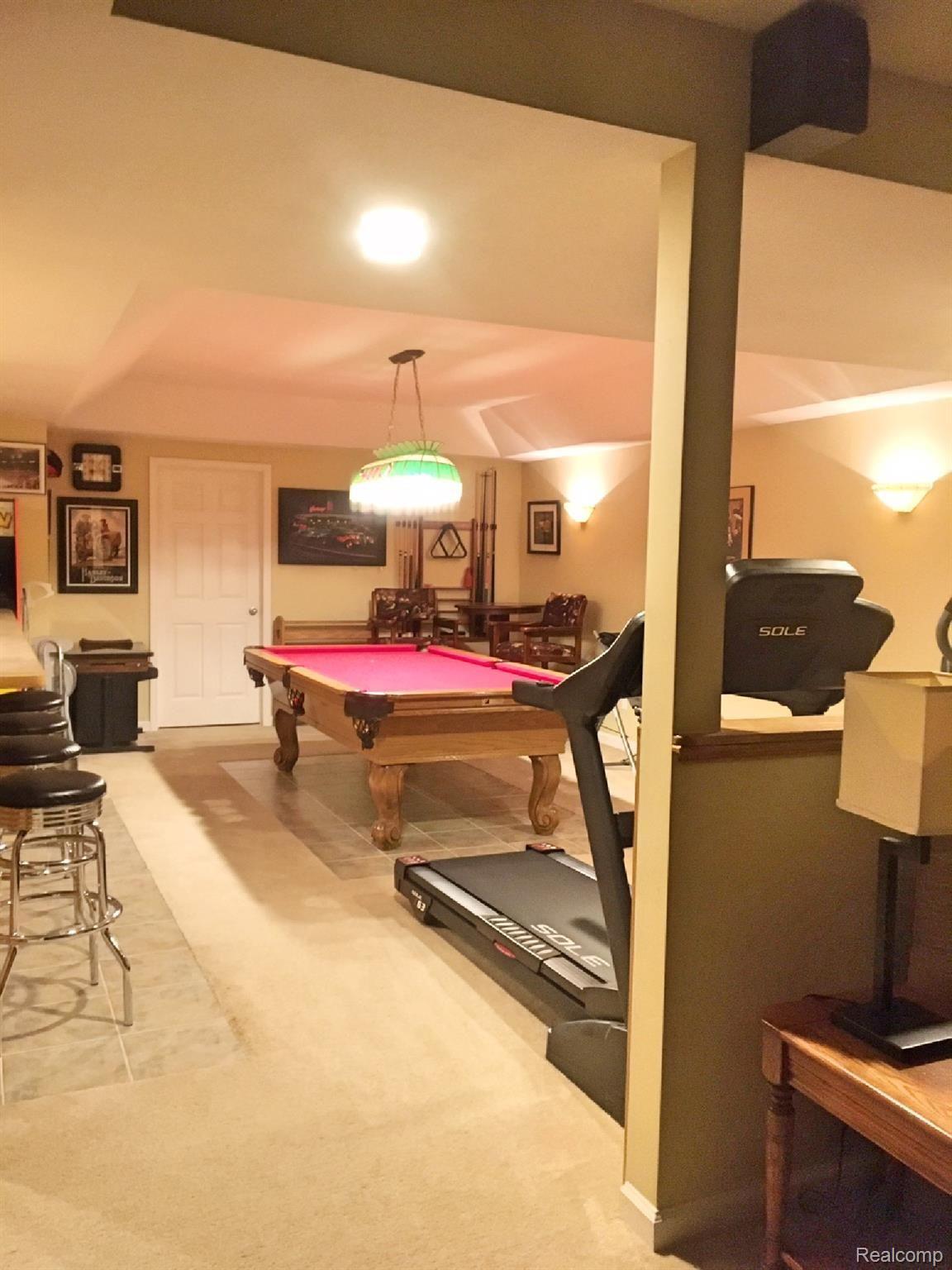 2839 Laurel Ridge Lane Howell, MI 48843 - Photo 13 of 18 Rec Room. Notice the tray ceiling!