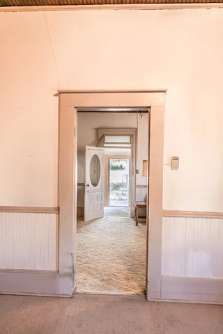 a view of a backyard with a table and chairs