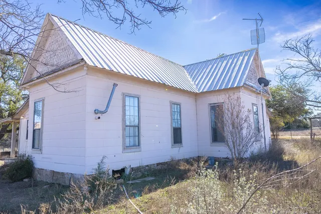 a view of a swimming pool with outdoor seating