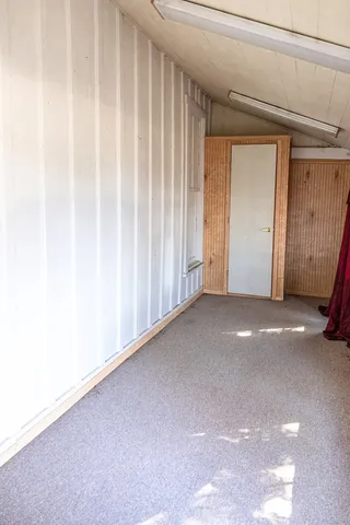 a spacious bathroom with a double vanity sink and mirror