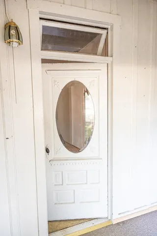 a view of kitchen with granite countertop cabinets appliances and a window