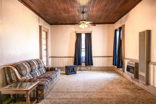 a view of hallway with wooden floor
