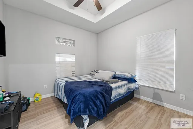 a bed room with a bed and a window