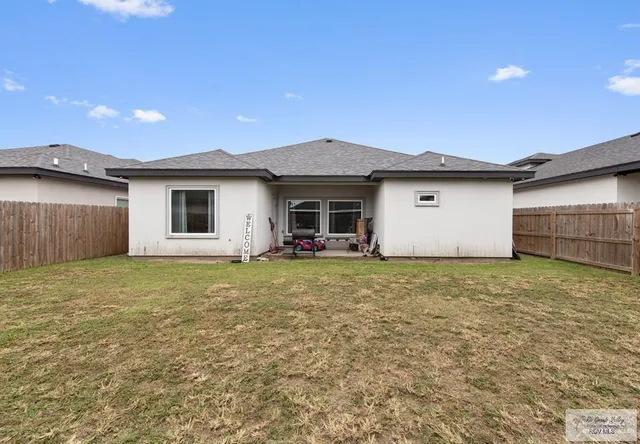 a house view with a backyard space