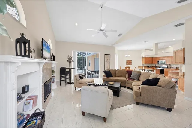 a living room with fireplace furniture and a fireplace