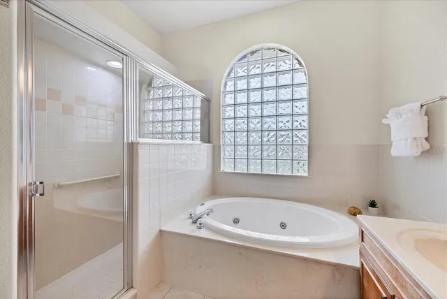 a bathroom with a bathtub and a shower