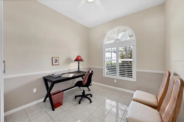 a view of a livingroom with furniture and a window