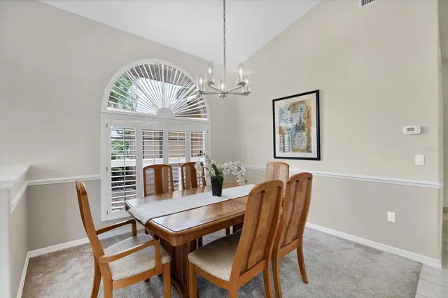 a dining room with furniture and window