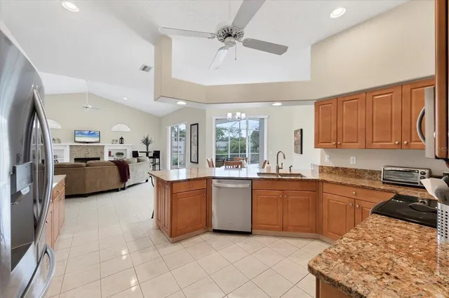 a kitchen with sink cabinets and window