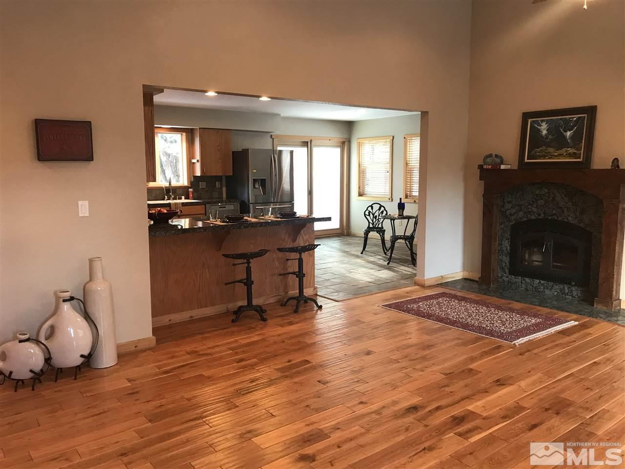 21715 Sazarac Road Reno, NV 89521 - Photo 6 of 25 a living room with furniture and a fireplace