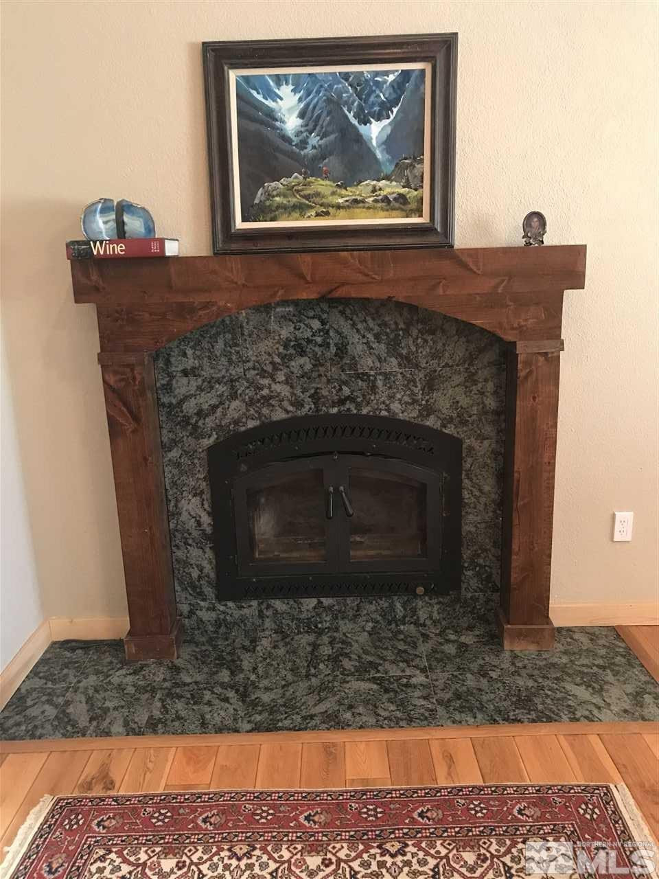 21715 Sazarac Road Reno, NV 89521 - Photo 7 of 25 a living room with a fireplace