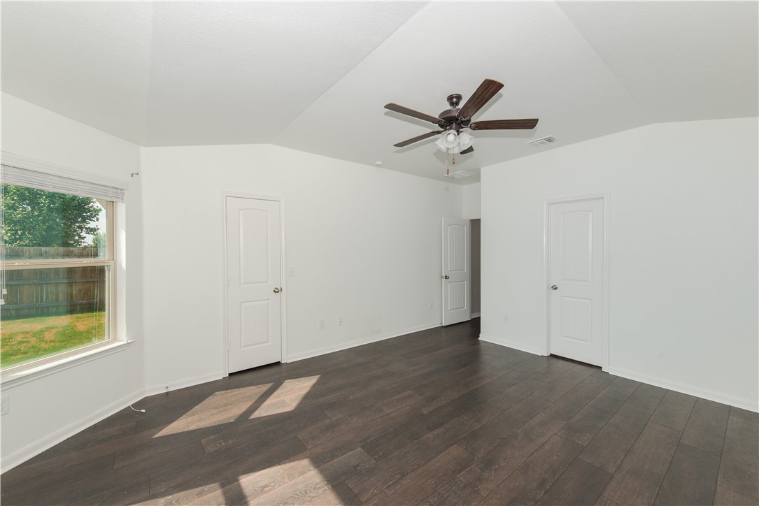 1007 Plateau Trail Georgetown, TX 78626 - Photo 13 of 32 a view of a room with a ceiling fan and wooden floor