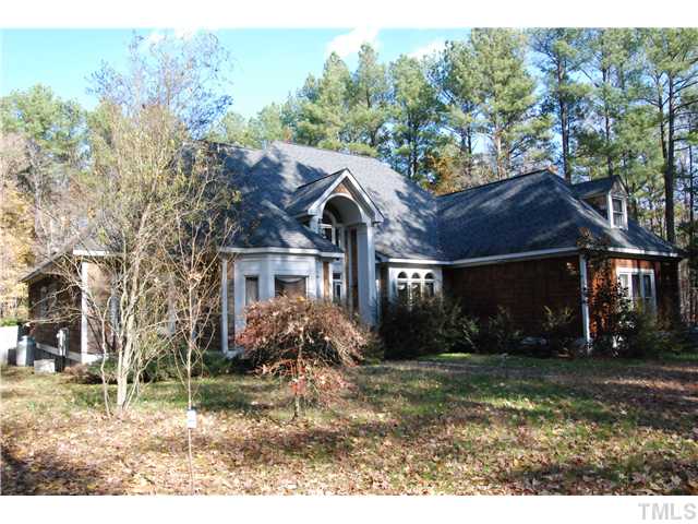 807 Neodak Road Apex, NC 27523 - Photo 2 of 12 Exterior Home is Cedar Shakes. Large Bay Window in the Study/Office & Decorative Windows in the Formal Dining.