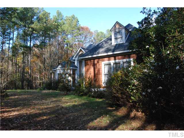 807 Neodak Road Apex, NC 27523 - Photo 3 of 12 Very Private Front Yard & Side Entry 3-Car Garage.
