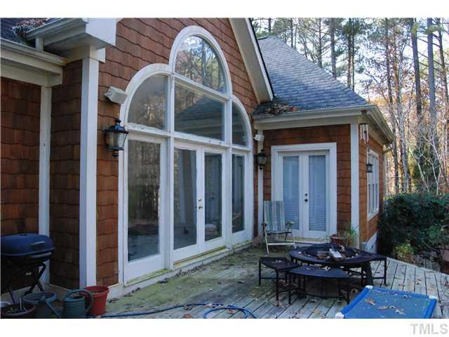 807 Neodak Road Apex, NC 27523 - Photo 5 of 12 Nice Windows & Glass Doors from the Living Room & Master Bedroom to the Huge 2-Tier Deck.