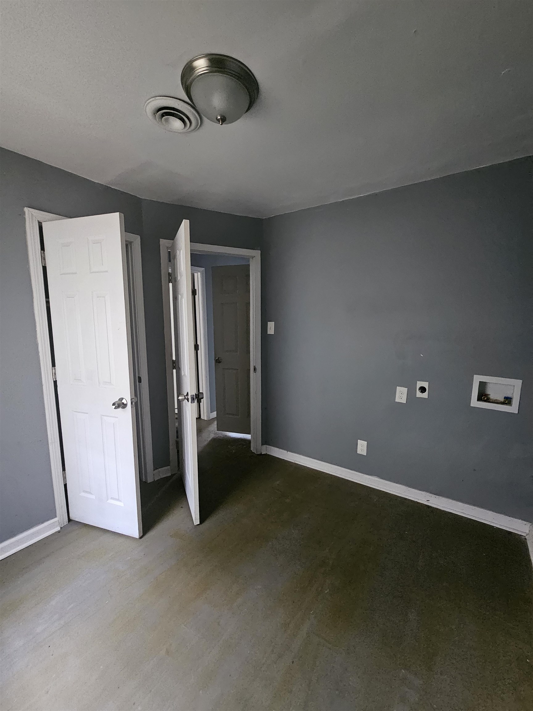 2059 Swift Street Memphis, TN 38109 - Photo 10 of 12 Room featuring a ceiling-mounted light fixture, HVAC vent, and light gray wall paint
