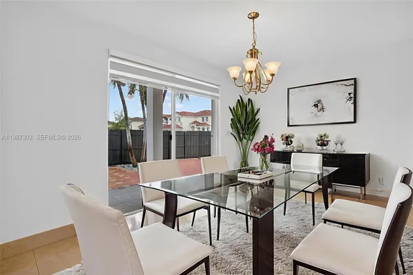 a view of a hallway with wooden floor and closet