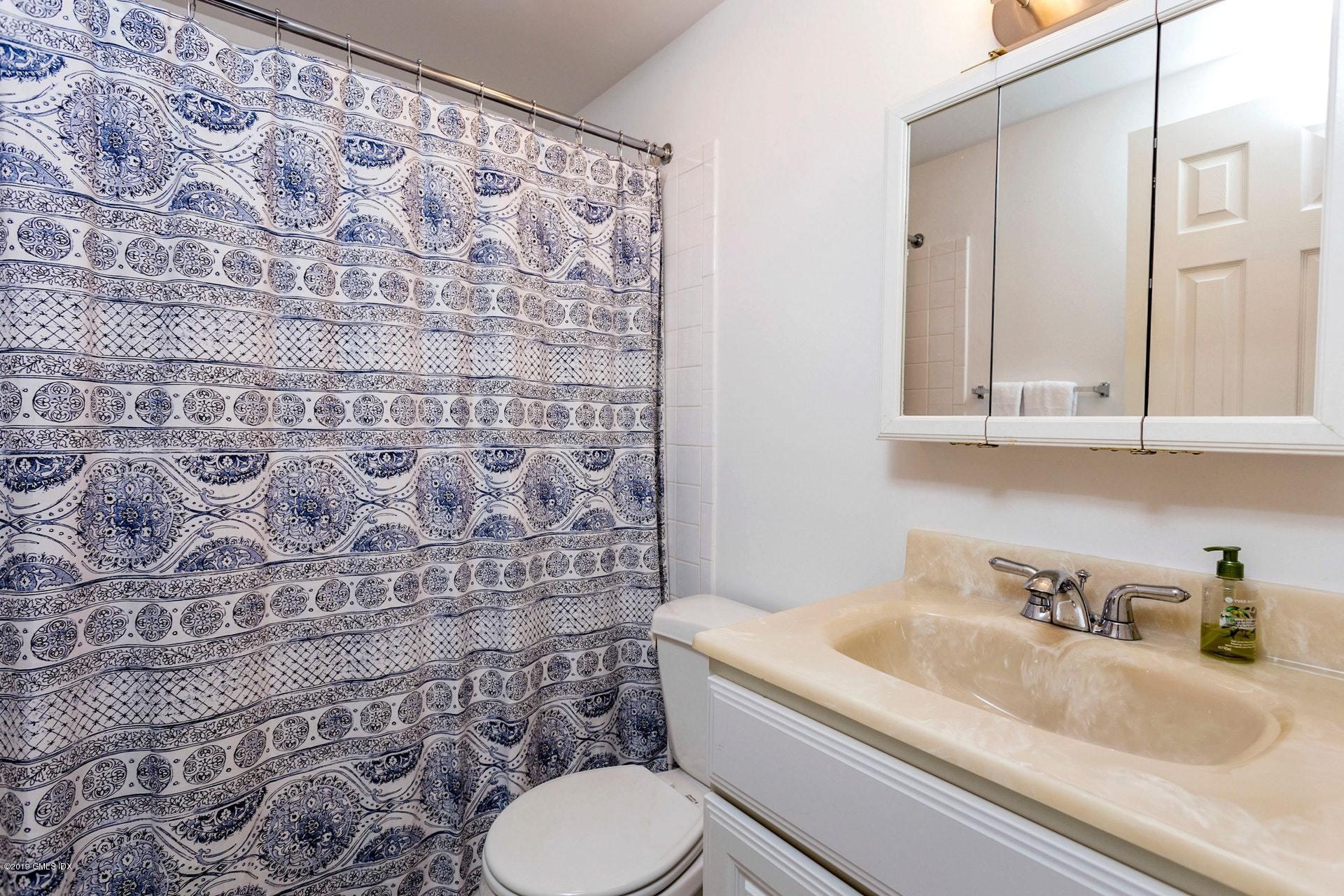 37 Meyer Place Riverside, CT 06878 - Photo 17 of 25 a bathroom with a granite countertop sink and a toilet