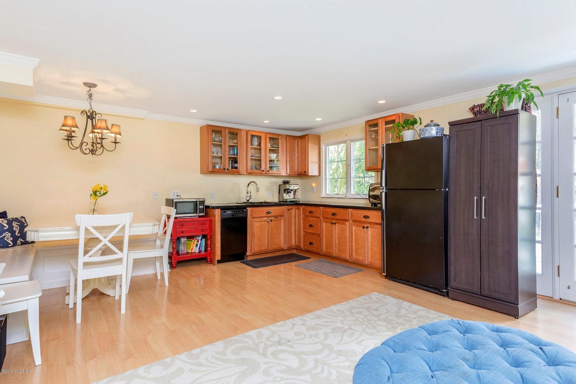 37 Meyer Place Riverside, CT 06878 - Photo 19 of 25 a kitchen with stainless steel appliances granite countertop a refrigerator and a stove top oven