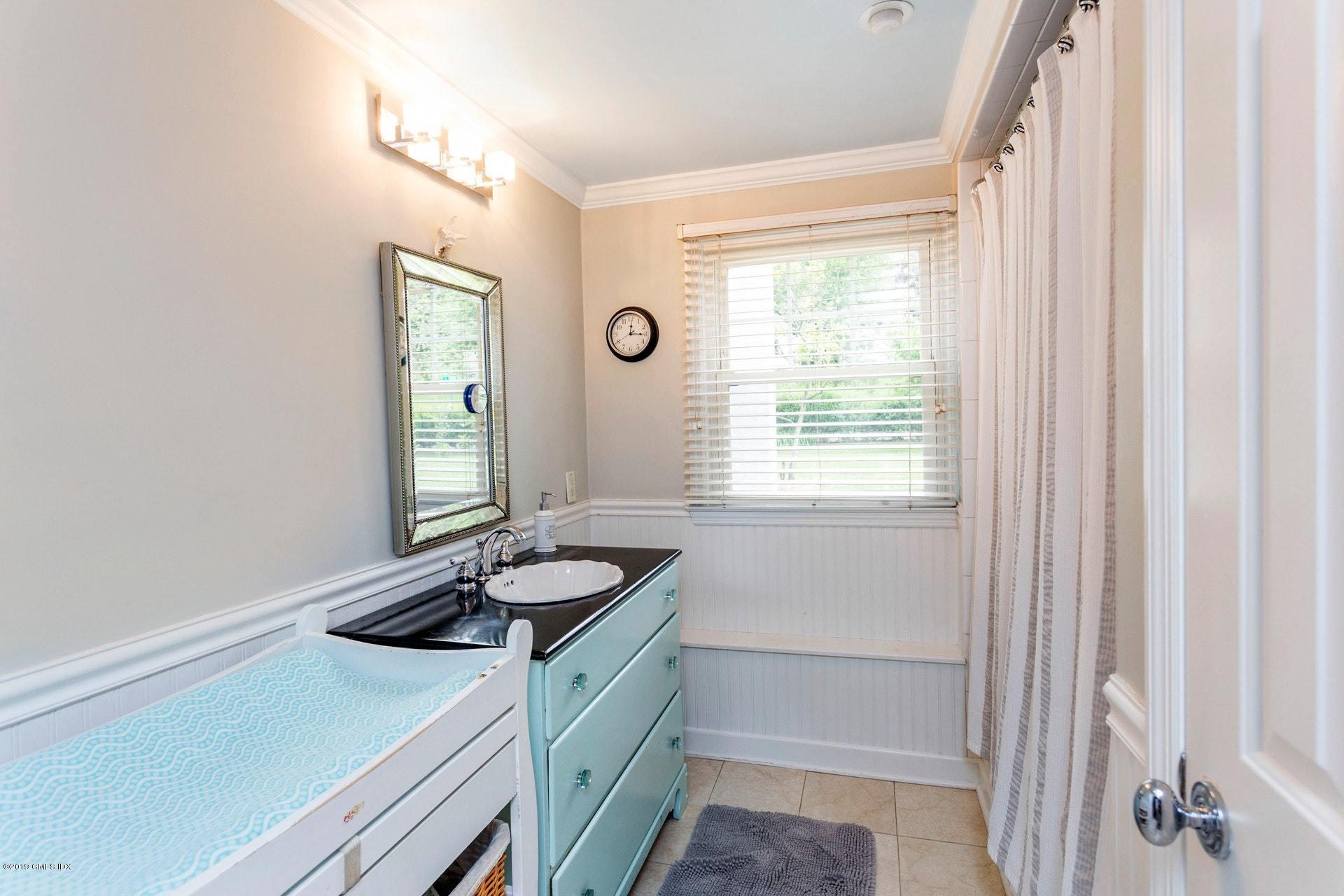 37 Meyer Place Riverside, CT 06878 - Photo 24 of 25 a bathroom with a sink a vanity and a window