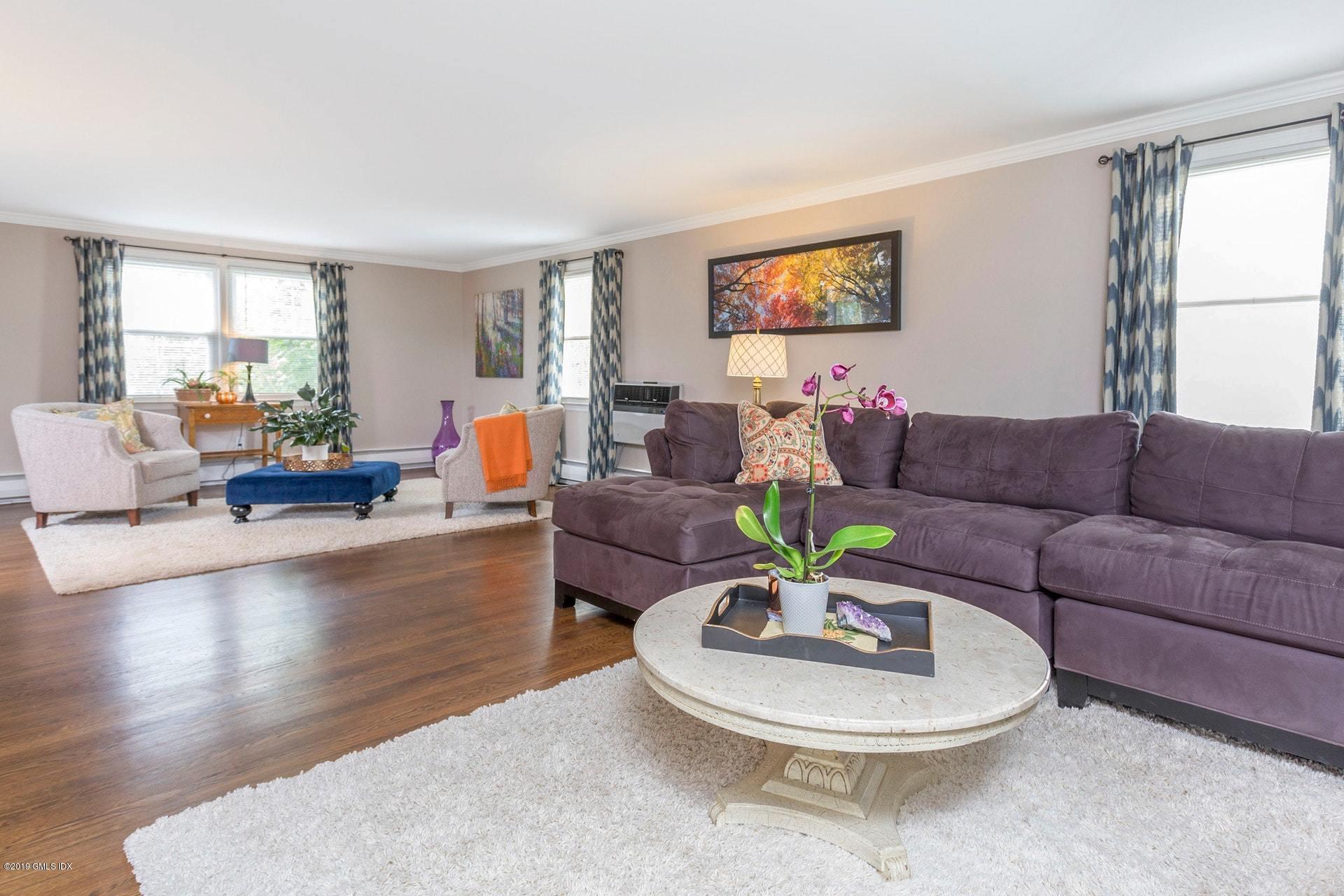 37 Meyer Place Riverside, CT 06878 - Photo 8 of 25 a living room with furniture and a wooden floor