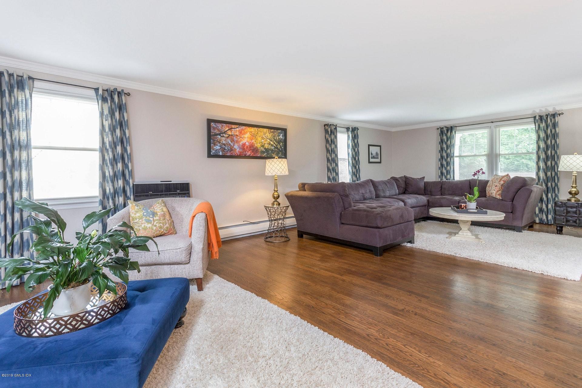 37 Meyer Place Riverside, CT 06878 - Photo 9 of 25 a living room with furniture and a large window
