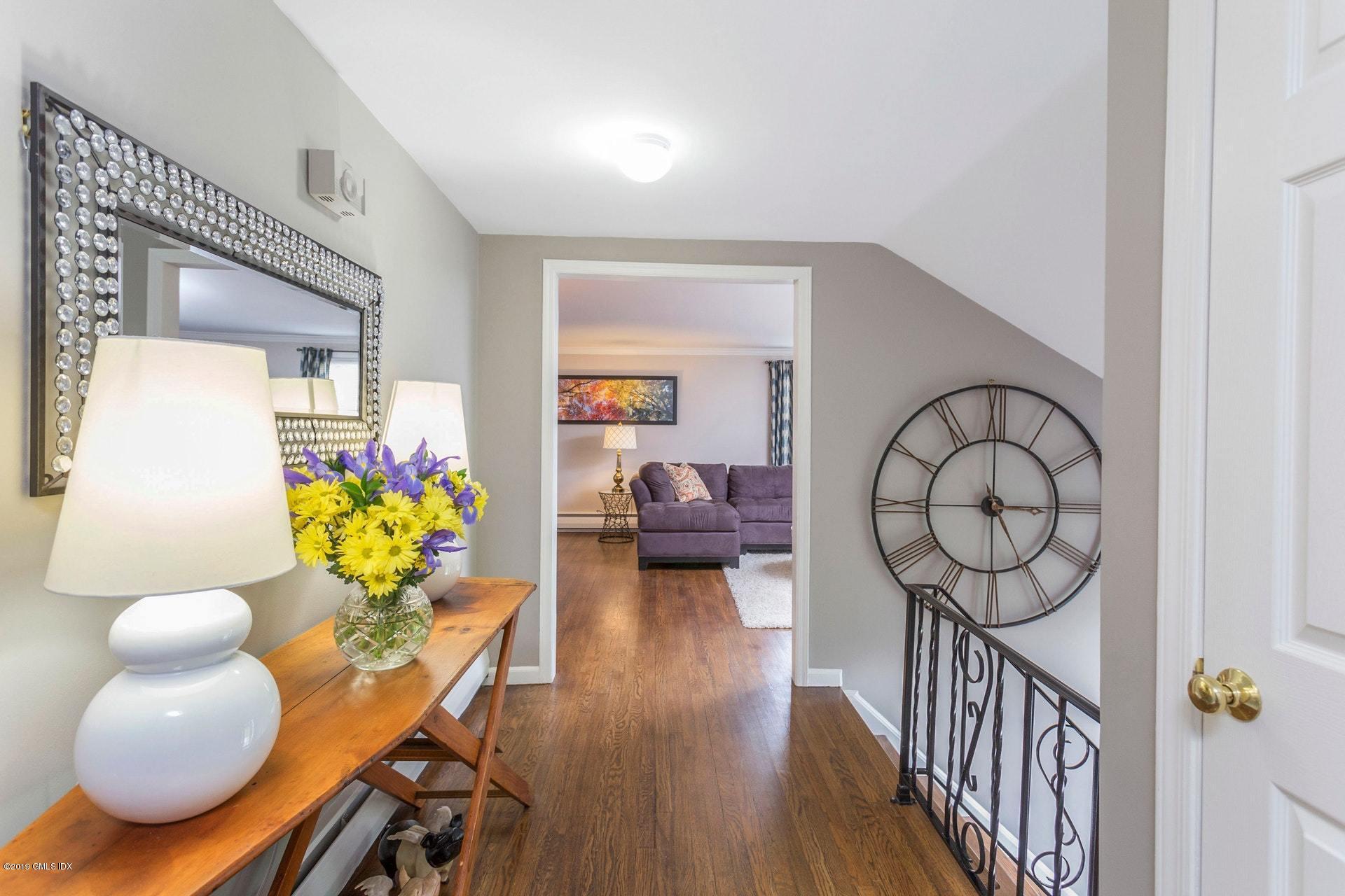 37 Meyer Place Riverside, CT 06878 - Photo 10 of 25 a living room with couches and a chandelier