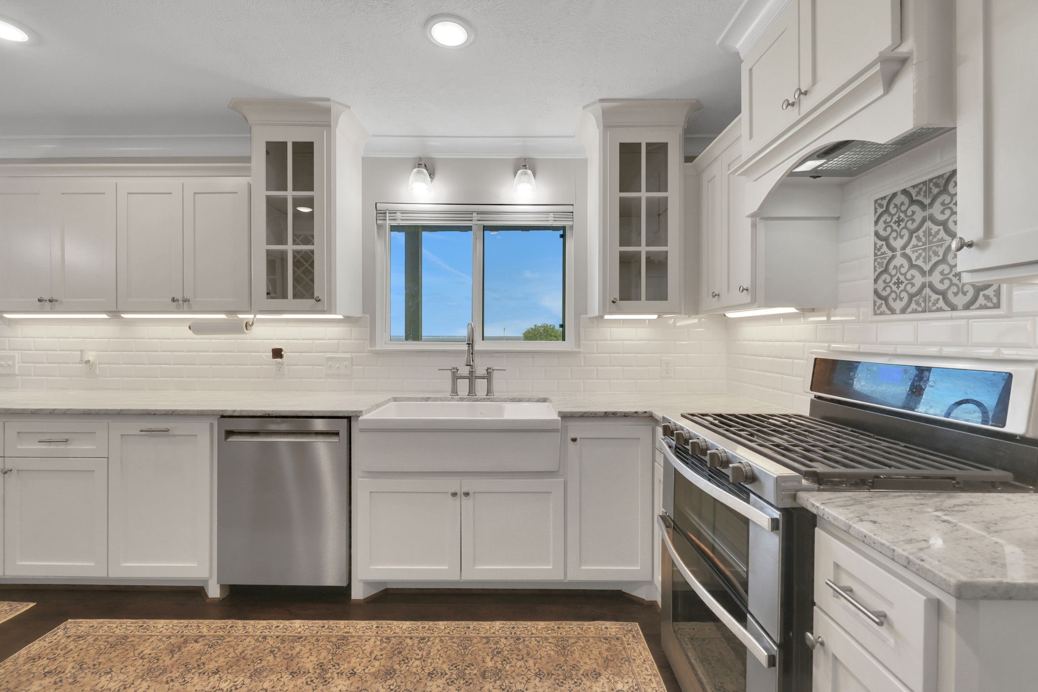 20 Ridgeway Drive Coldspring, TX 77331 - Photo 2 of 40 a kitchen with stainless steel appliances granite countertop a sink stove and cabinets