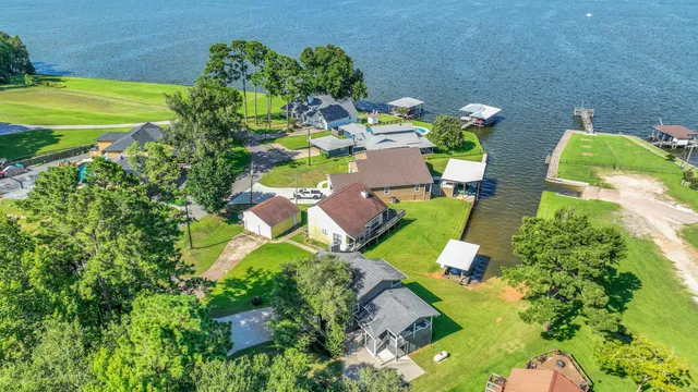 a view of a swimming pool with a yard