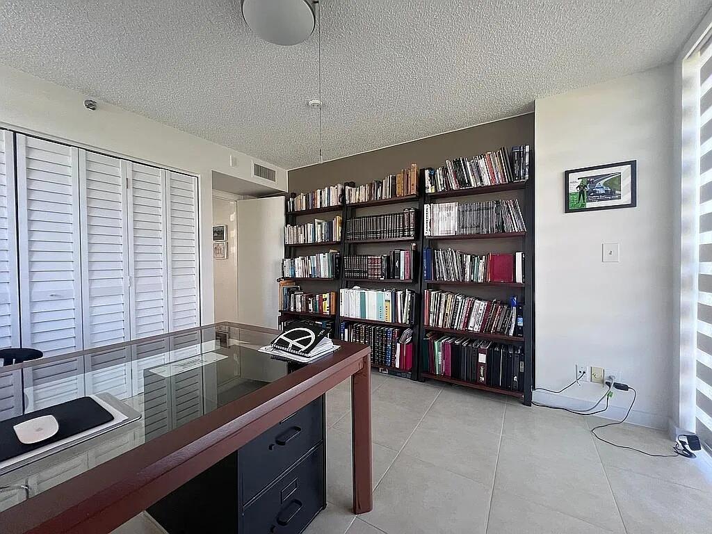 6463 La Costa Drive, Unit 105 Boca Raton, FL 33433 - Photo 19 of 40 a kitchen with stainless steel appliances granite countertop a sink and cabinets