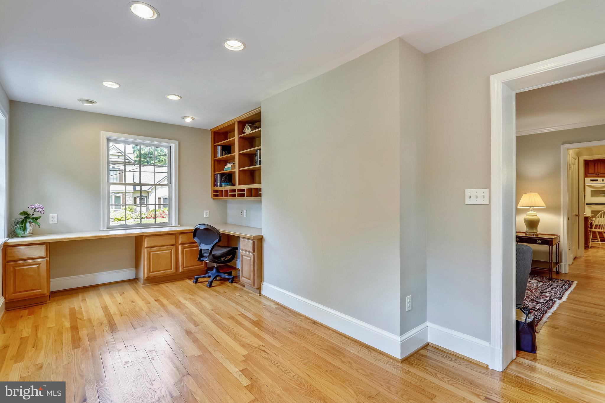 6308 Alcott Road Bethesda, MD 20817 - Photo 11 of 34 Study off living room w/built-in desk & shelving