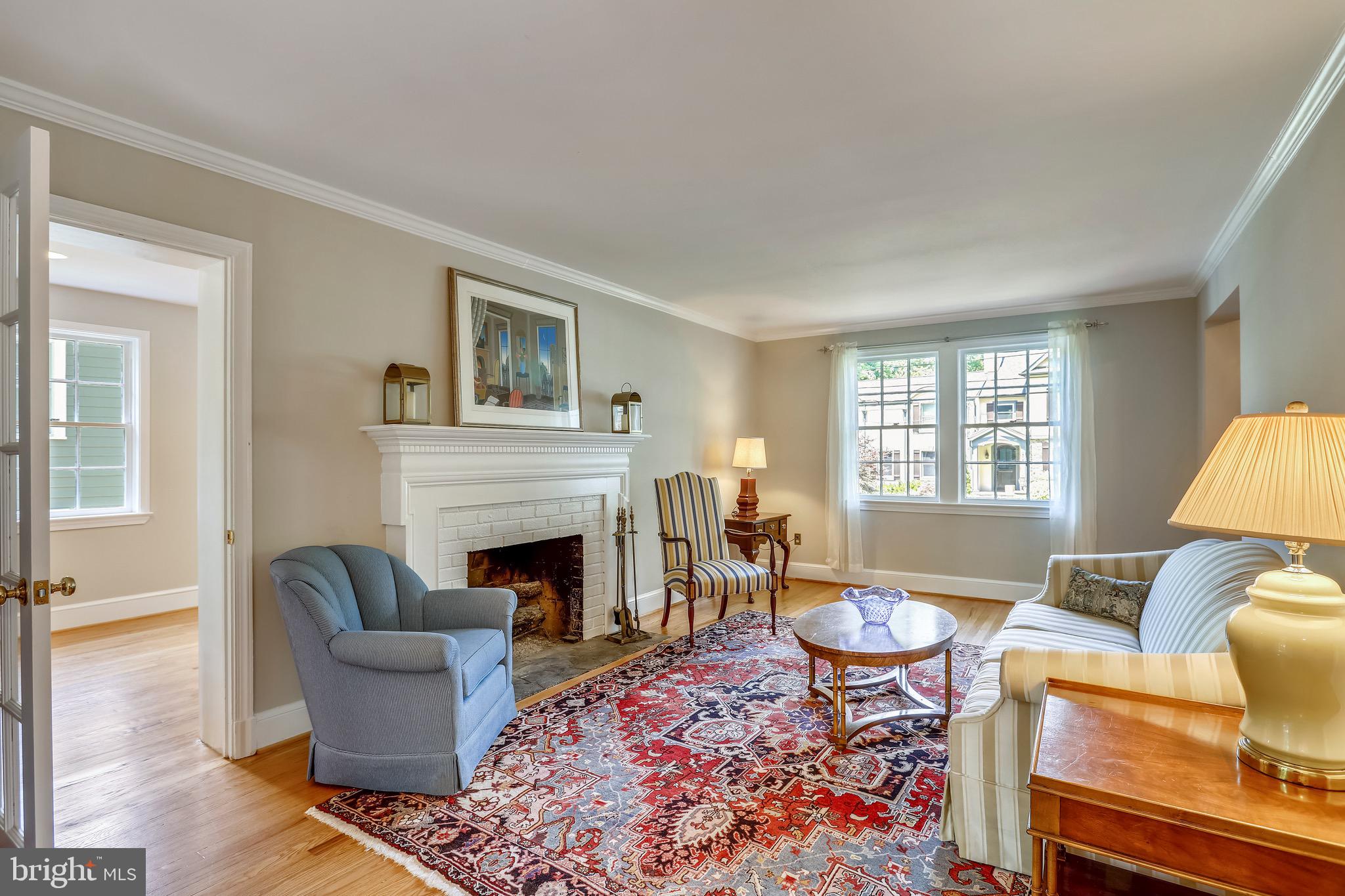 6308 Alcott Road Bethesda, MD 20817 - Photo 10 of 34 Sunny living room with wood burning fireplace