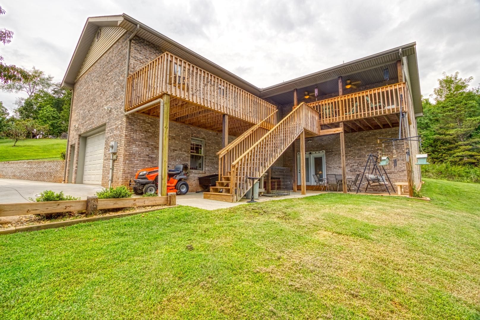 720 Rock House Road Kodak, TN 37764 - Photo 17 of 18 a view of a house with a yard and sitting area
