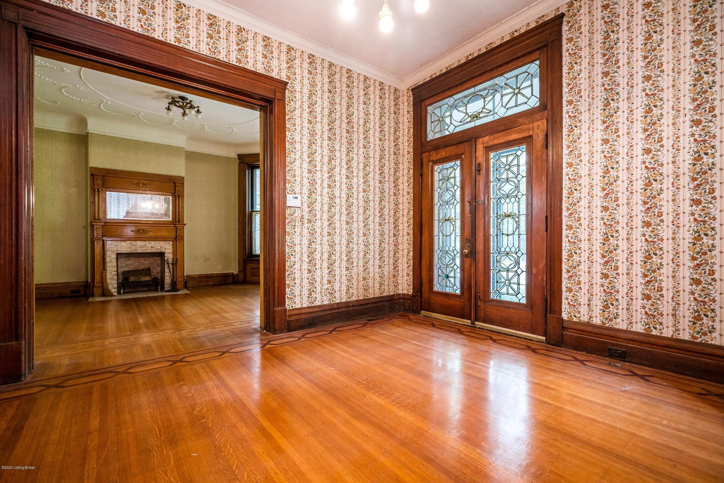 UNIT # 1 LEAD GLASS FRONT DOORS LOOKING AT LIVING ROOM