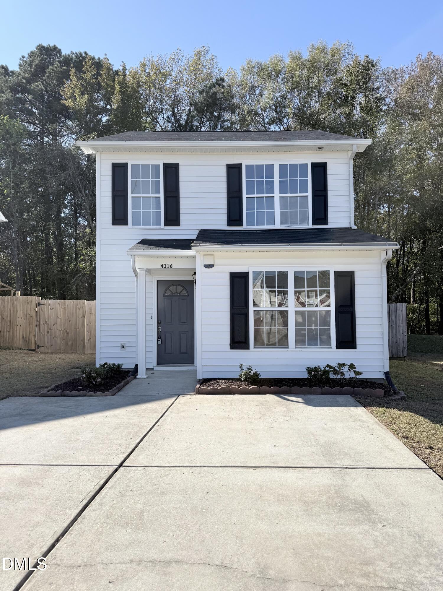 4316 Haverty Drive Raleigh, NC 27610 - Photo 1 of 16 a house with trees in the background