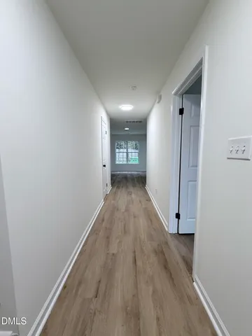 a view of entryway with wooden floor