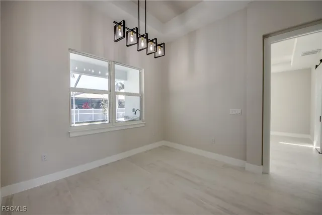 a view of empty room with windows