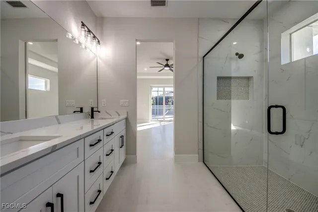 a bathroom with a double vanity sink and mirror
